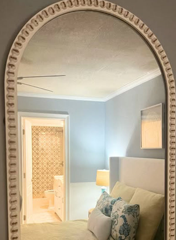 Mirror placement enhances the bedroom